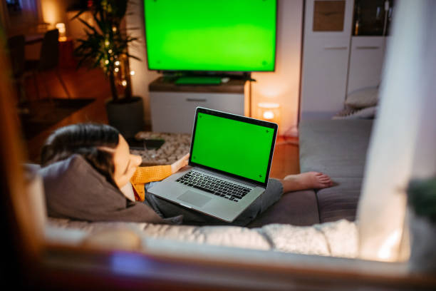 istock Woman sleeping on couch with laptop 1295349906