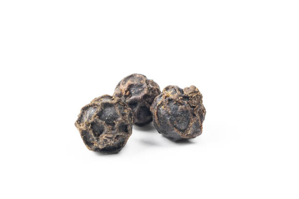 istock black peppercorns with a visible texture on a white background 1295355770