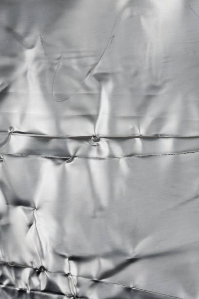 istock crumpled silver aluminum foil. background or texture 1295356592