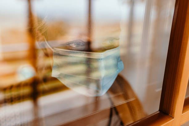 istock Woman in isolation at home 1295357569