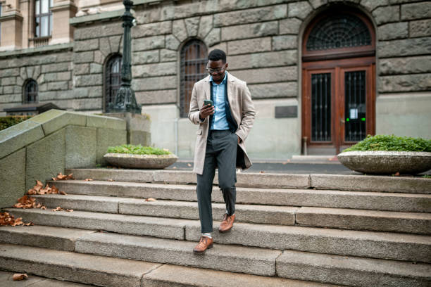 istock Young African American businessman using a smart phone 1295360817