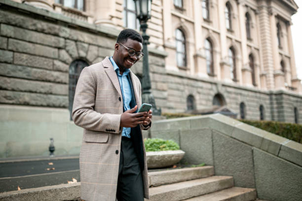 istock Young African American businessman using a smart phone 1295361539