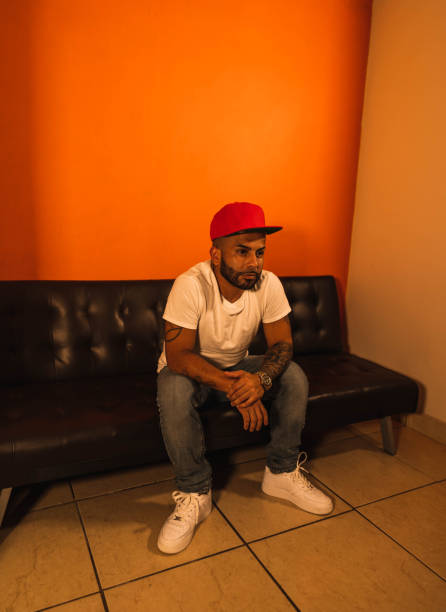 istock Beard man resting in the living room couch 1295364694