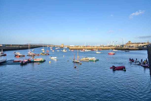 Stunning view of Dun Laoghaire harbor in the evening on a crispy cold sunny day Dublin, Ireland. Boats in Dun Laoghaire harbor stock photo