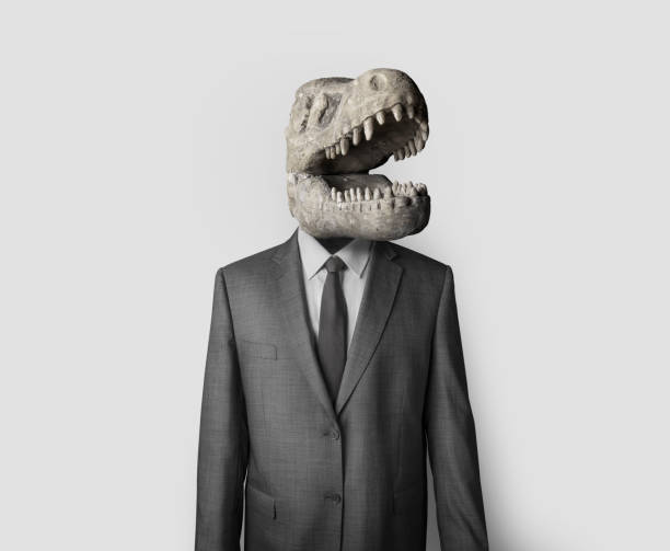 коллажное изображение человека в костюме с черепом динозавра вместо головы - business person suspicion clothing well dressed стоковые фото и изображения