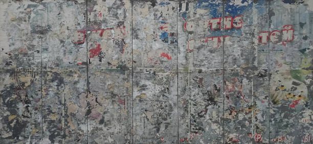 istock The surface of the street billboard with leftover ads 1295373018