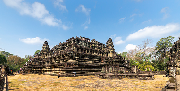 Siem Reap, Cambodia - January 24, 2020: The Baphuon is a temple at Angkor, Cambodia. It was built in the mid-11th century and dedicated to the Hindu God Shiva.