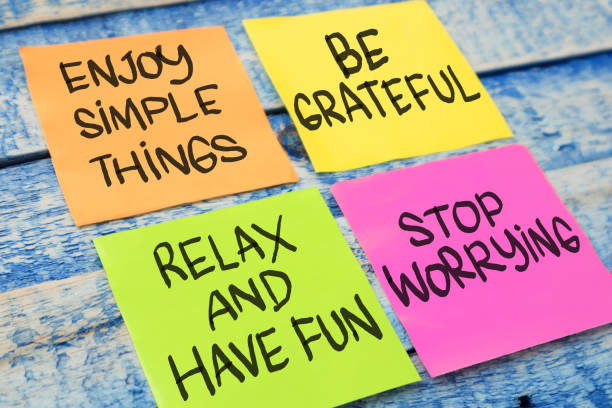 istock Enjoy simple things be grateful relax have fun stop worrying, text words typography written on paper, life and business motivational inspirational concept 1295385501