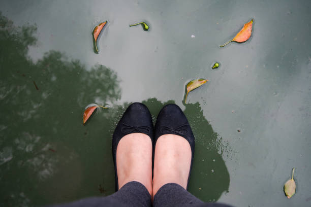 istock Wet shoes after rainy day 1295385603