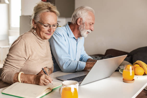 istock Home finances planning for a senior couple 1295385613