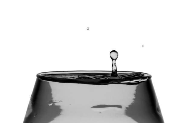 Drop of frozen water falling and making a realistic and natural splash.