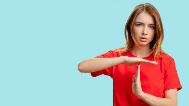 istock time up break gesture protesting woman t sign 1295388084