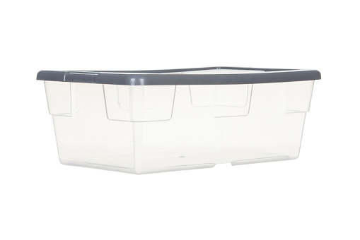 View of a transparent plastic box with a gray lid, to store various products on a white background.