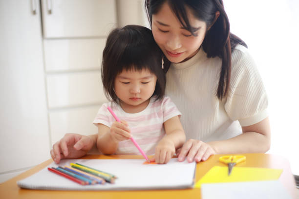 istock Parent and child to draw 1295393705