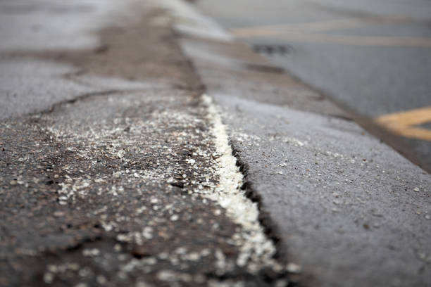 istock Driving part and sidewalk is sprinkled with anti-slip material 1295393732
