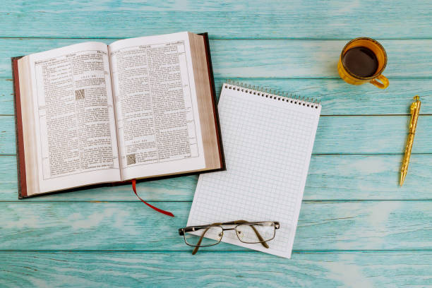 istock Personal reading the Holy Bible study with cup of coffee 1295393938