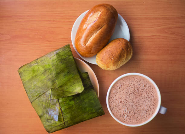 Top view of delicious hallaca, with fresh bread and coffee