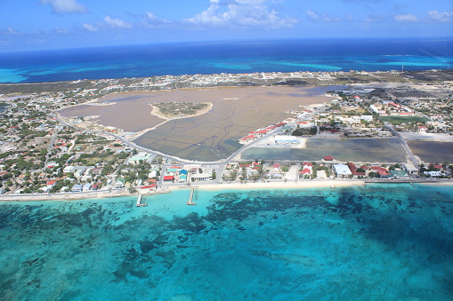 Grand Turk, capital of Turks & Caicos, and the Atlantic Ocean are seen from an aerial view.