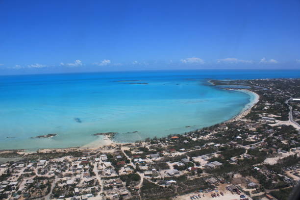 Aerial view of Providenciales, Turks & Caicos Homes on Providenciales, and the Atlantic Ocean, are seen from an aerial view. providenciales stock pictures, royalty-free photos & images