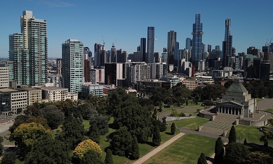 Aerial shots of Melbourne city against a bright blue sky