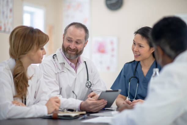 istock Multi ethnic healthcare workers meeting together 1295402838