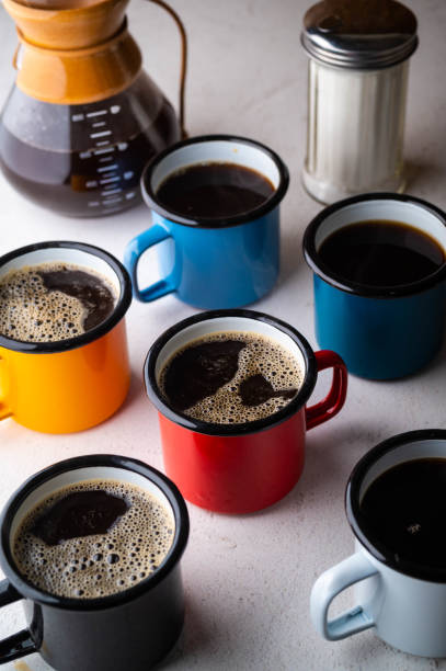istock coffee in many colorful mugs on white background 1295403558