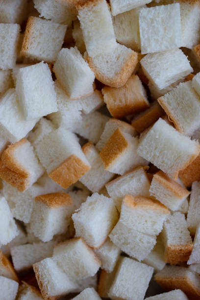 istock Diced white bread cubes background for homemade 1295410063
