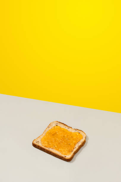 istock Delicious toast with lemon jam on gray background 1295411904