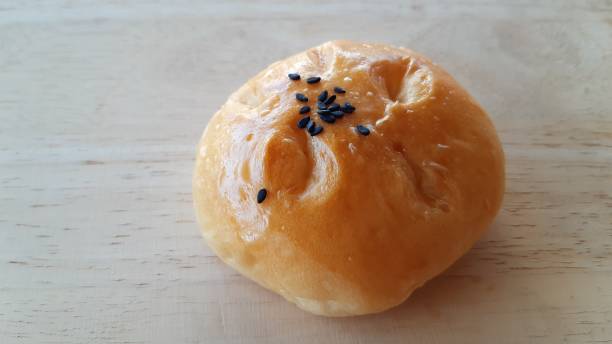 istock Taro filled bun on wood table. 1295416010