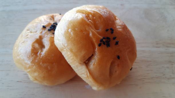 istock Taro filled bun on wood table. 1295416014