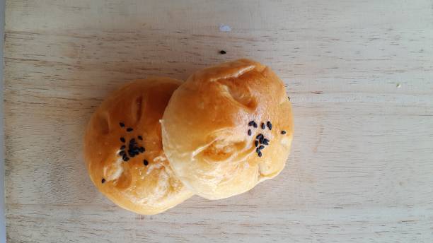 istock Taro filled bun on wood table. 1295416015