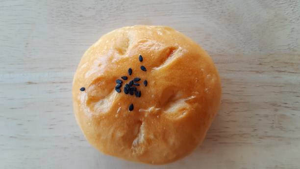 istock Taro filled bun on wood table. 1295416035