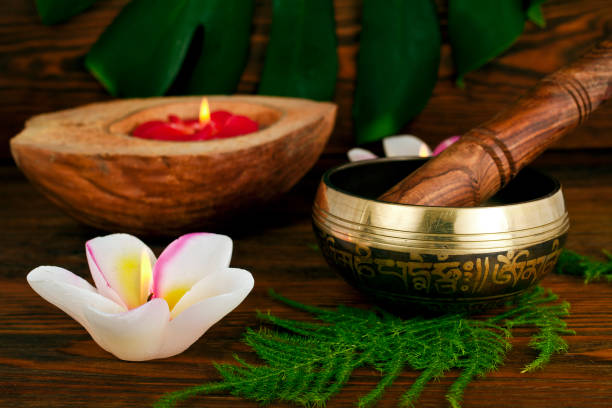 istock Tibetan singing bowl with monstera leaf and coconut candle 1295419080