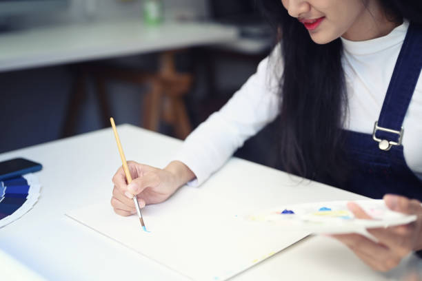 Cropped shot of young female student having classes at art studio.