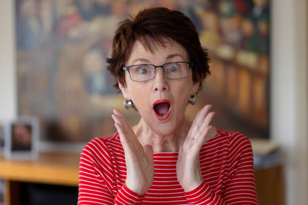 istock Shocked woman indoors. 1295421884