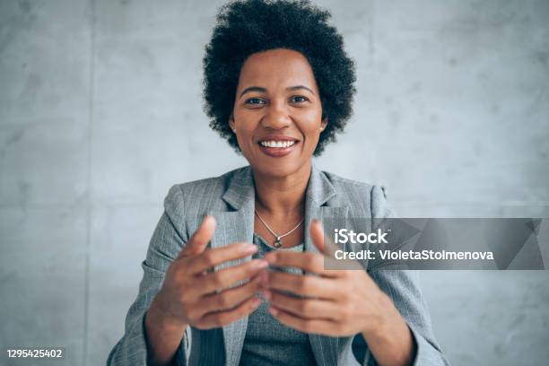 Businesswoman Talking During Video Call In The Office Stock Photo - Download Image Now