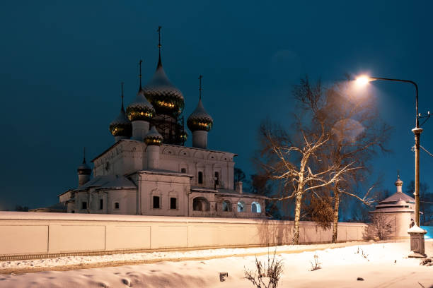 Blurred silhouette of the Orthodox Temple during a snowfall at night.