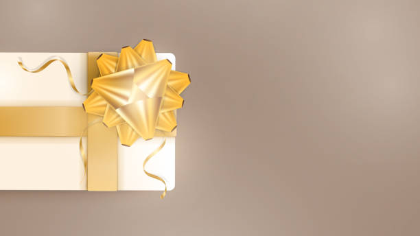 istock Chocolate colored background with realistic champagne color gift boxes, gold ribbons and bow. Background with space for text. View from above. Vector 1295427424