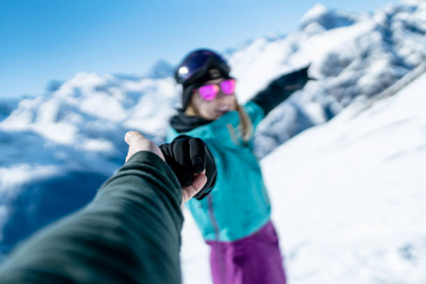 istock Follow me concept at ski resort. Selective focus on a hands. 1295427539