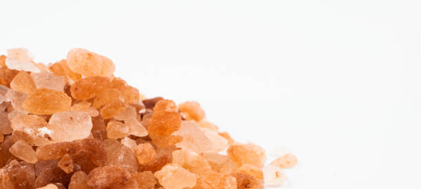 istock Pink himalayan salt on a white background with visible details 1295429659