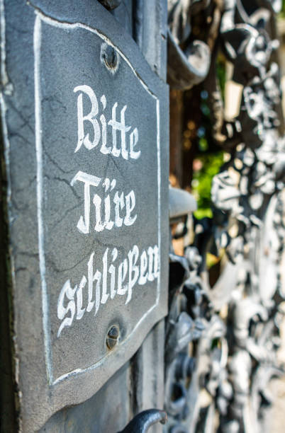 istock old sign in germany - close the door 1295433356