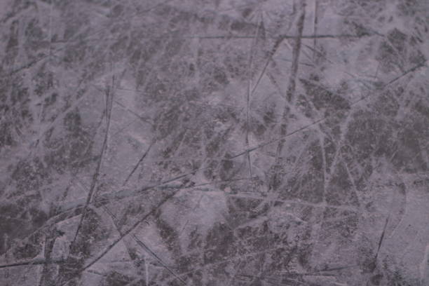 istock Surface of Ice Rink in Snow with Skate Tracks 1295433443