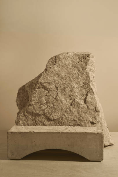 istock Stone and a piece of tile podium on a beige background 1295435735