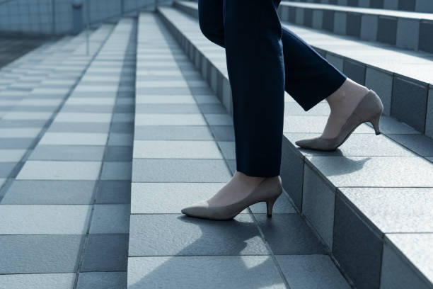 istock Woman walking on the stairs 1295442357