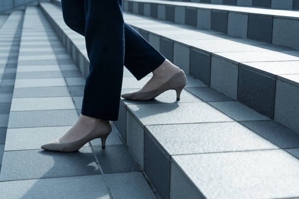 Woman walking on the stairs Woman walking on the stairs women high heels stock pictures, royalty-free photos & images