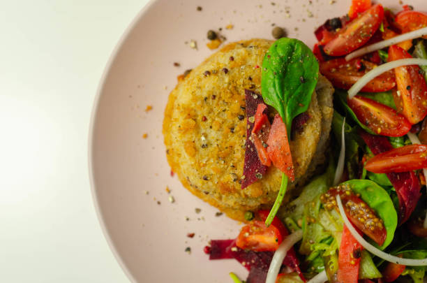 istock Smoked haddock fishcake with melting cheddar sauce and mixed salad, 1295443035
