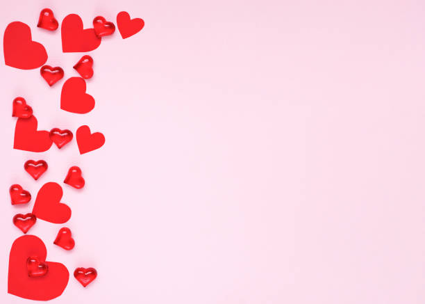 istock Blurred Valentine's Day concept with Pink hearts on Pink background with defocused lights. 1295443052