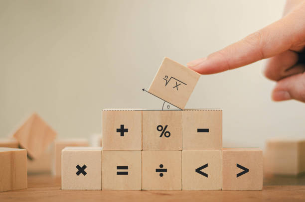 Math symbols written on the wooden blocks of a businessman With calculations with ideas A concept, a difficult problem or a mathematical solution Math symbols written on the wooden blocks of a businessman With calculations with ideas A concept, a difficult problem or a mathematical solution algebra photos stock pictures, royalty-free photos & images
