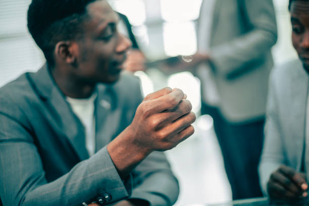 istock young business man discussing something with his colleague 1295446406