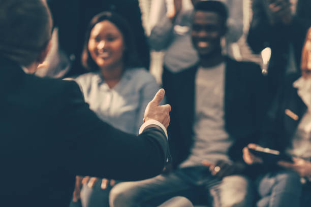 istock close up. the speaker when making a speech for young entrepreneurs 1295446439